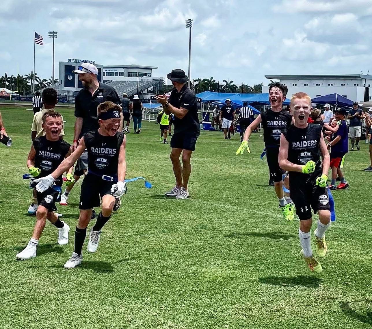 Team celebrating and running at IMG Academy